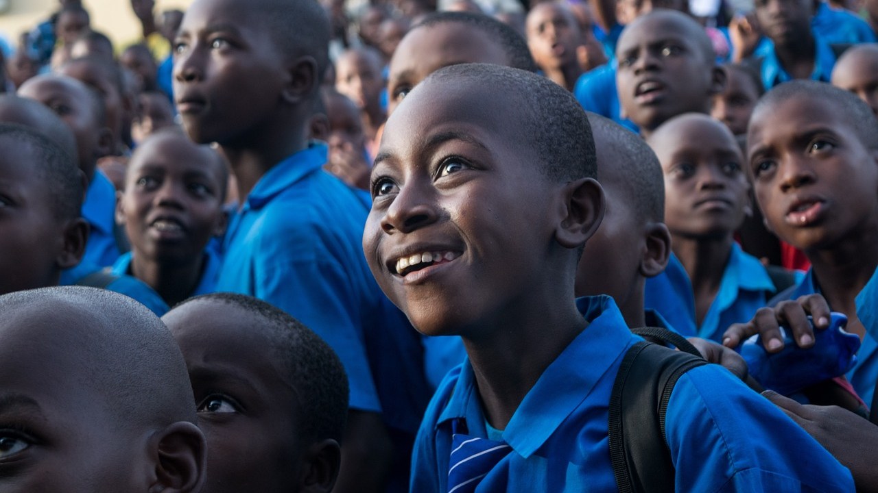 Children smiling together at a Chrysolite Foundation community outreach